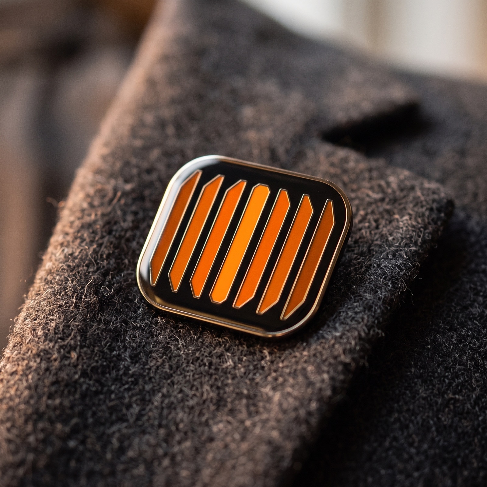 The icon as hard-enamel merch.