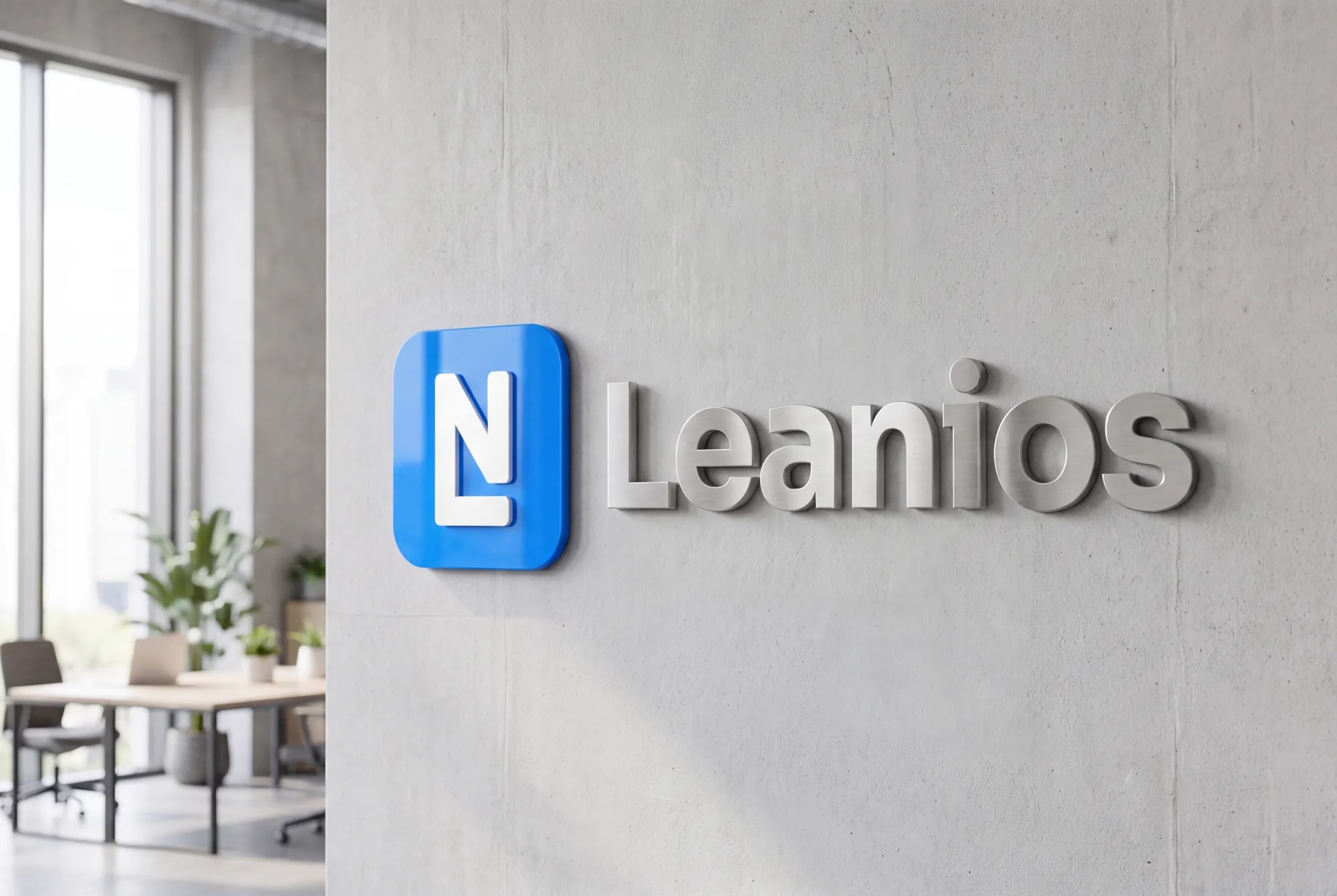 The logo in the workplace: the blue mark and steel wordmark on a wall.